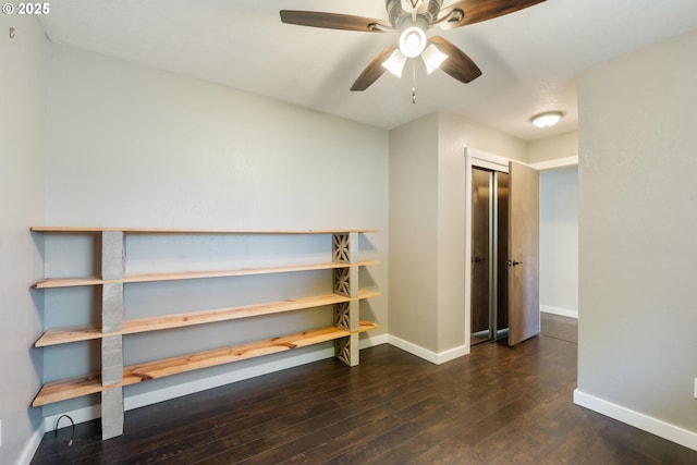 1770 Mccormick Loop Rd, Tillamook, OR 97141 - unfurnished bedroom with baseboards, hardwood / wood-style floors, ceiling fan, and a closet