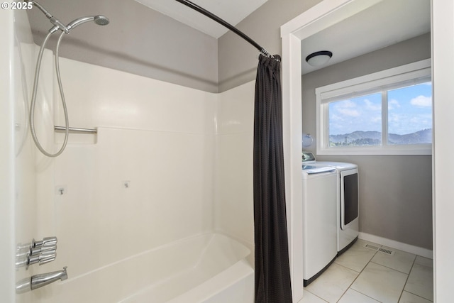 1770 Mccormick Loop Rd, Tillamook, OR 97141 - bathroom with separate washer and dryer, shower / bathtub combination with curtain, baseboards, and tile patterned floors