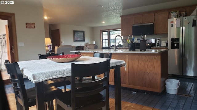 living area featuring baseboards and carpet