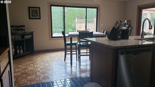 kitchen featuring a sink, stainless steel fridge with ice dispenser, and recessed lighting