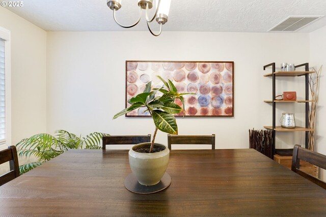 dining area featuring a chandelier