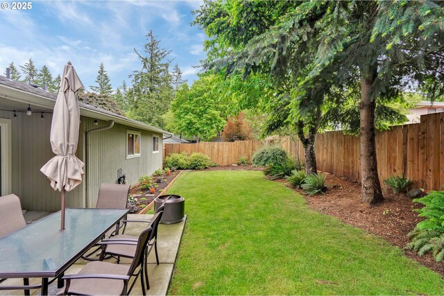 view of yard with outdoor dining space