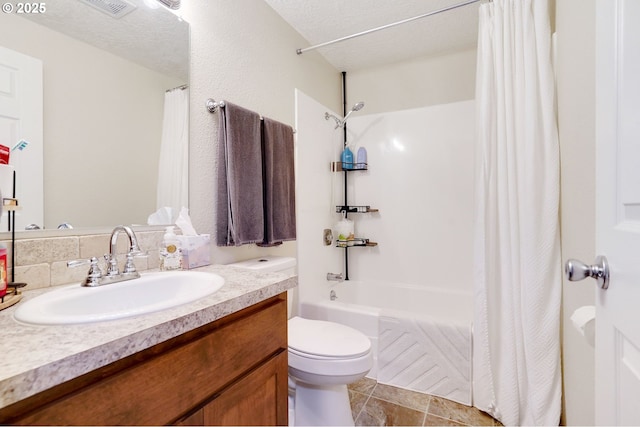 full bathroom featuring toilet, vanity, and shower / tub combo with curtain