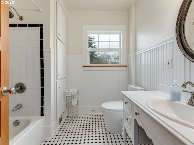 487 Arkansas Ave, Vernonia, OR 97064 - bathroom with vanity, shower / bathtub combination, wainscoting, and toilet