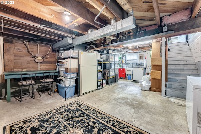 487 Arkansas Ave, Vernonia, OR 97064 - basement with wood walls, washing machine and clothes dryer, and freestanding refrigerator