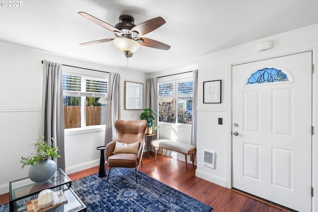 foyer featuring dark hardwood / wood-style floors and ceiling fan