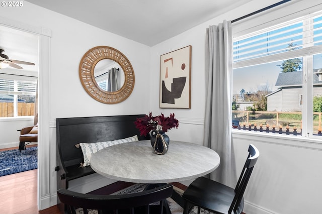 dining area featuring hardwood / wood-style floors and ceiling fan