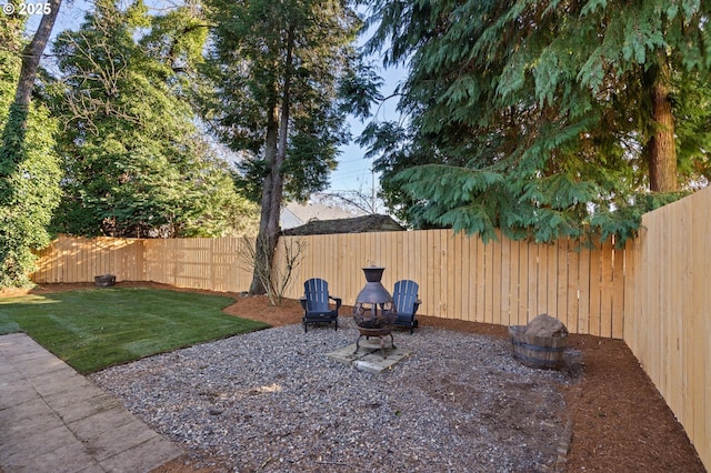 view of yard with an outdoor fire pit