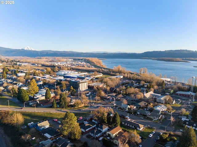 aerial view featuring a water and mountain view