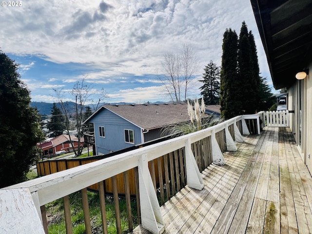 wooden deck with a mountain view