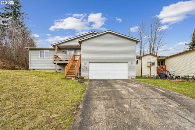 ranch-style home with an attached garage, driveway, stairway, and a front yard