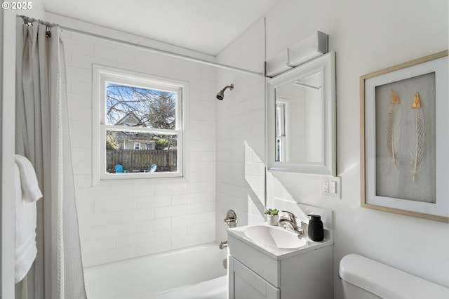 bathroom with toilet, shower / tub combo with curtain, and vanity