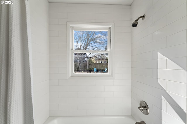 bathroom with shower / bath combo