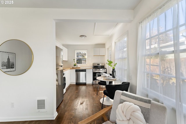 interior space featuring dark wood-style floors and visible vents