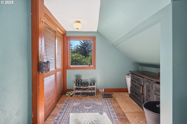 22405 NE 167th Ave, Battle Ground, WA 98604 - additional living space with hardwood / wood-style flooring, vaulted ceiling, and baseboards