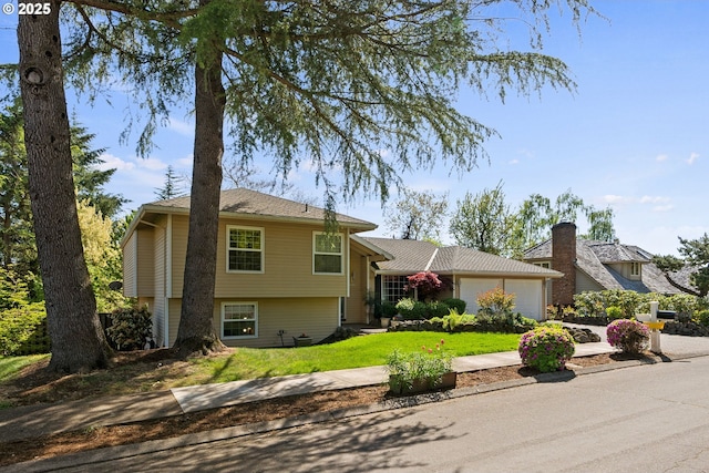 4134 Orchard Way, Lake Oswego, OR 97035 - tri-level home featuring a garage, a front lawn, and driveway