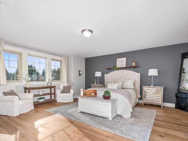 bedroom with light wood-type flooring