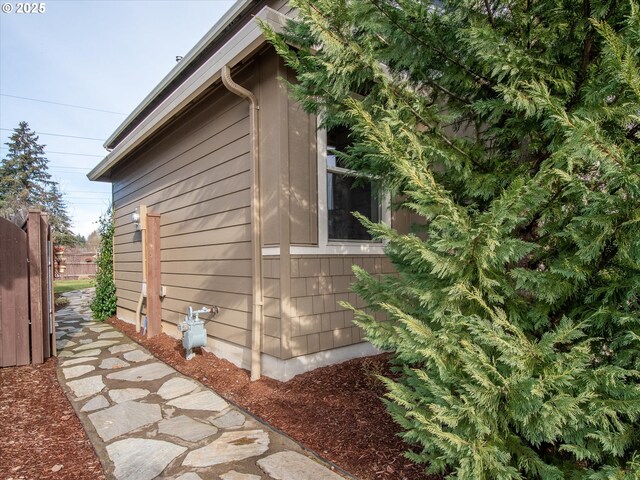 back of house with a yard and a patio