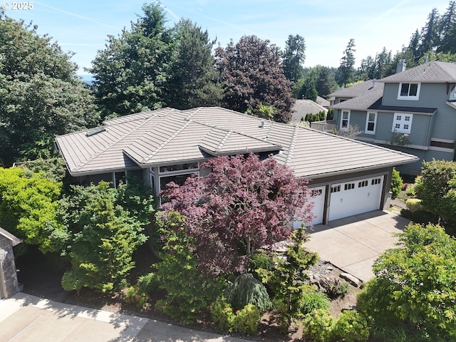 22040 Shannon Pl, West Linn, OR 97068 - view of front of property featuring concrete driveway, an attached garage, and a tile roof