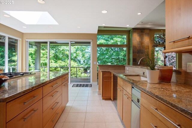 22040 Shannon Pl, West Linn, OR 97068 - kitchen with a sink, a skylight, plenty of natural light, light tile patterned flooring, and recessed lighting