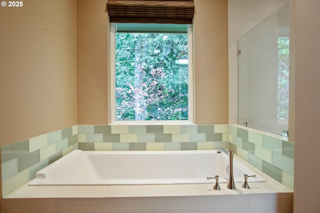 full bath with a garden tub