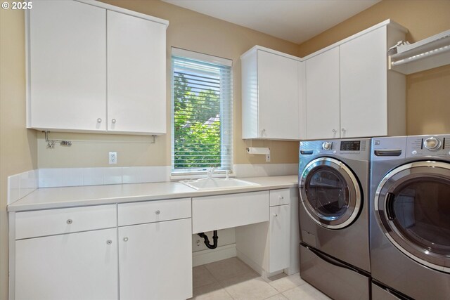 22040 Shannon Pl, West Linn, OR 97068 - laundry room featuring independent washer and dryer, cabinet space, and light tile patterned floors
