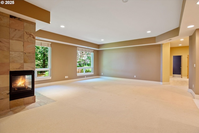 22040 Shannon Pl, West Linn, OR 97068 - unfurnished living room with light colored carpet, baseboards, recessed lighting, and a tile fireplace