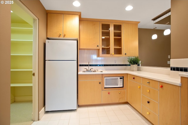 22040 Shannon Pl, West Linn, OR 97068 - kitchen with white appliances, a sink, light countertops, glass insert cabinets, and recessed lighting