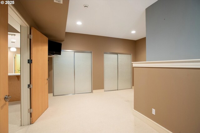 22040 Shannon Pl, West Linn, OR 97068 - unfurnished bedroom featuring multiple closets and recessed lighting