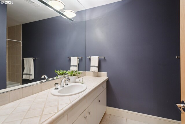 22040 Shannon Pl, West Linn, OR 97068 - bathroom with vanity, tile patterned floors, shower / bathtub combination, and baseboards