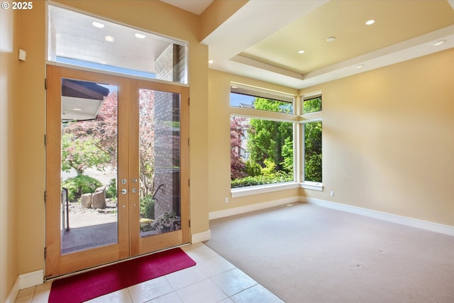doorway to outside featuring french doors, baseboards, tile patterned floors, carpet, and recessed lighting
