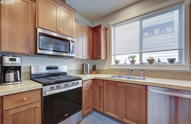 530 N Helens View Dr, Ridgefield, WA 98642 - kitchen featuring stainless steel appliances, a sink, and brown cabinets