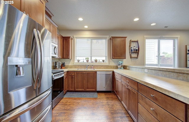 530 N Helens View Dr, Ridgefield, WA 98642 - kitchen featuring stainless steel appliances, a sink, recessed lighting, healthy amount of natural light, and dark wood-style flooring