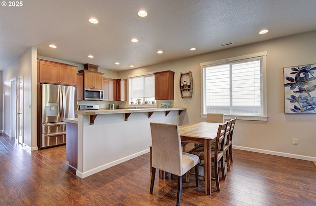 530 N Helens View Dr, Ridgefield, WA 98642 - dining space featuring dark wood-type flooring, baseboards, and recessed lighting