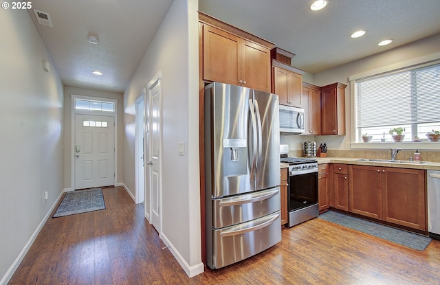530 N Helens View Dr, Ridgefield, WA 98642 - kitchen featuring stainless steel appliances, a sink, wood finished floors, recessed lighting, and light countertops