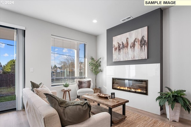 living area with light hardwood / wood-style floors