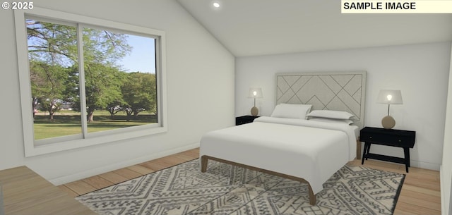 bedroom featuring lofted ceiling and light hardwood / wood-style flooring