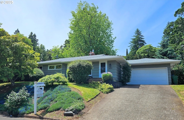 3185 Granada Way, Salem, OR 97302 - view of front of property featuring asphalt driveway, a chimney, and an attached garage