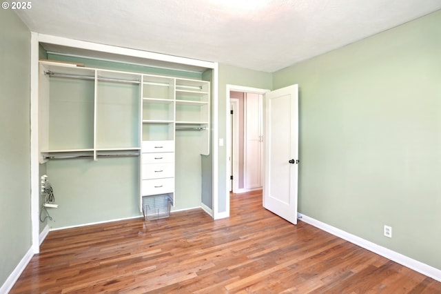 3185 Granada Way, Salem, OR 97302 - unfurnished bedroom with a closet, wood finished floors, and baseboards