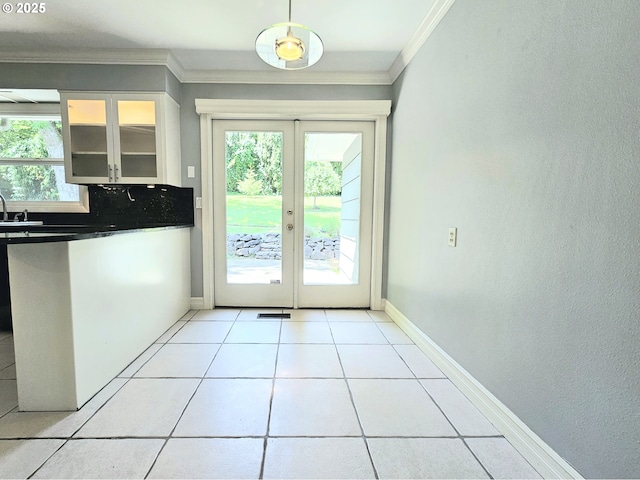 3185 Granada Way, Salem, OR 97302 - entryway featuring ornamental molding, french doors, light tile patterned floors, a sink, and baseboards
