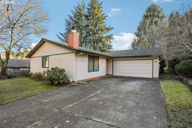 view of front facade featuring a garage and a front lawn