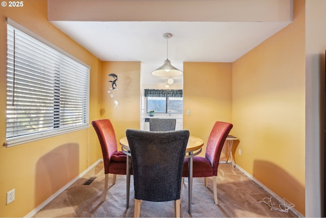 dining area featuring carpet floors