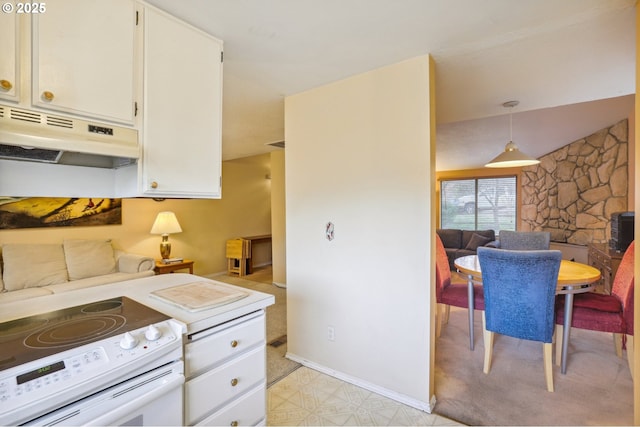 kitchen with pendant lighting, white cabinets, and white electric range oven