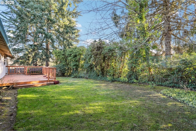 view of yard featuring a wooden deck