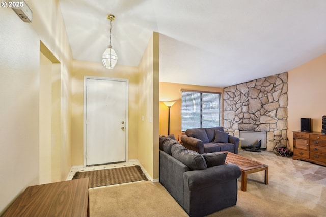 living room with a fireplace and carpet floors