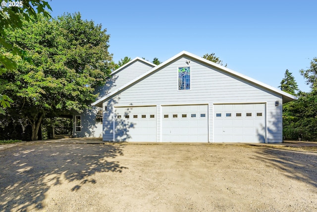 23535 SW Newland Rd, Wilsonville, OR 97070 - view of front of home with a garage and asphalt driveway