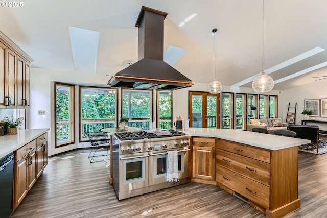 23535 SW Newland Rd, Wilsonville, OR 97070 - kitchen featuring double oven range, island range hood, light countertops, wood finished floors, and vaulted ceiling