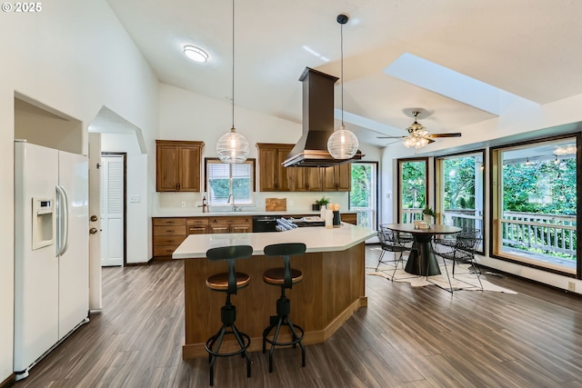 23535 SW Newland Rd, Wilsonville, OR 97070 - kitchen featuring white fridge with ice dispenser, island exhaust hood, brown cabinetry, dark wood-style floors, and light countertops