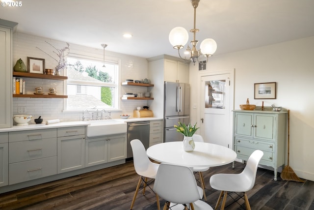 dining space featuring recessed lighting, an inviting chandelier, and dark wood finished floors