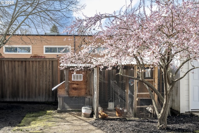 view of poultry coop featuring fence